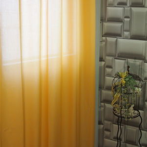 κουρτίνα ραμμένη με τρουκς , γάζα κίτρινη σε διαστάσεις 1,40 χ 2,80 ύψος